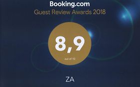Zа